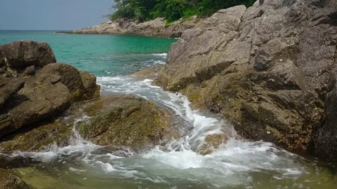 Movement of sea water between the rocks on tropical beach. Thailand Stock Footage 72101239