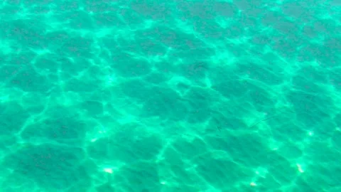 The movement of sea water creats reflections looks like connecting neurons Stock Footage 165949166
