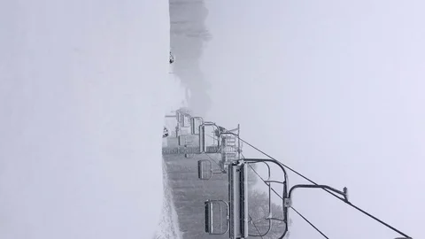 Movement of seats on the cable car in a winter snowstorm. Stock Footage 124274247