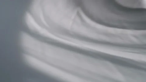 The movement of the shadows from the curtains on a white background. Stock Footage 157555825