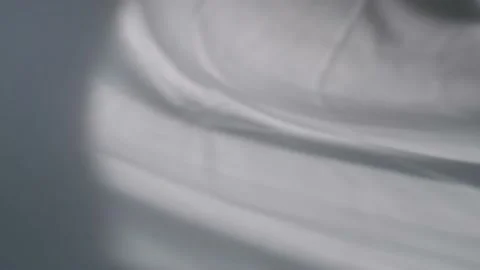 The movement of the shadows from the curtains on a white background. Stock Footage 157642988