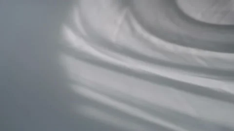 The movement of the shadows from the curtains on a white background. Stock Footage 157692793