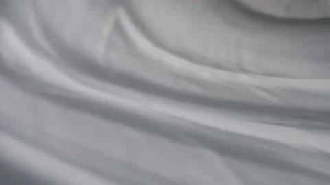 The movement of shadows from curtains on a white background. Defocusing. Bokeh. Stock Footage 157766253