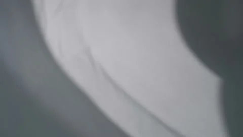 The movement of the shadows from the curtains on a white background. Video stock 159816426