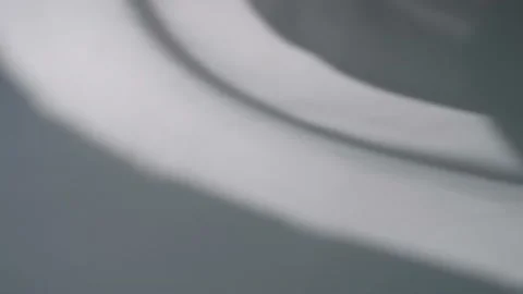 The movement of the shadows from the curtains on a white background. Stock Footage 160482323