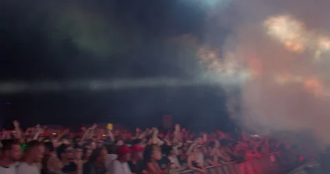 The movement smoke on the stage flashes the lights to the rhythm of the music Stock Footage 217809017