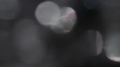 The movement of the sparkling white bokeh towards the left 動画素材 317451075