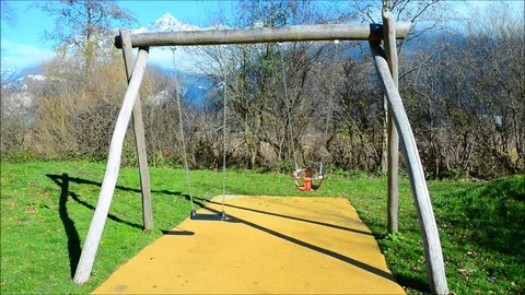 The movement of the swing is swinging. Swing for small children and baby Video stock 82460230