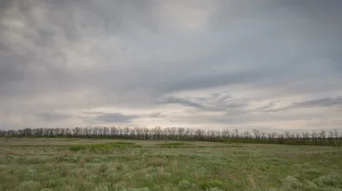 The movement of the thunderclouds over the fields of winter wheat Stock Footage 67868019