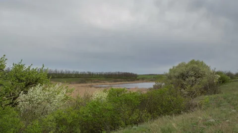 The movement of the thunderclouds over the fields of winter wheat Stock Footage 67869913