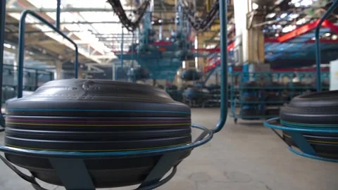 Movement of tires on the overhead conveyor Stock-Footage 318537272