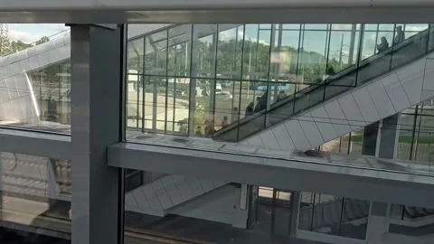 Movement together with the passengers of the train on the overpass, escalator Stock Footage 155131255