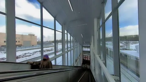 Movement together with the passengers of the train on the passenger overpass  Stock Footage 150200585