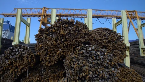 Movement to the top of a large pile of thin metal fittings at a construction Stock Footage 120351393