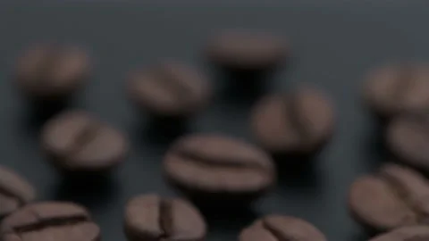 Movement towards the coffee beans on a black matte table 4k Stock Footage 151164919
