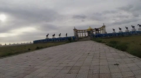Movement Towards the Mongolian Stone Monument on Empty Road Pov Stock Footage 62569929