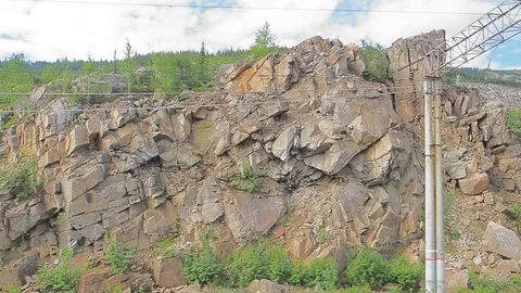 The movement of the train on the mountain pass a summer day Stock Footage 77913882