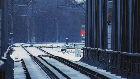 The movement of the train on the rail tracks in winter. Slow motion. close-up 4k Stock Footage 99626148