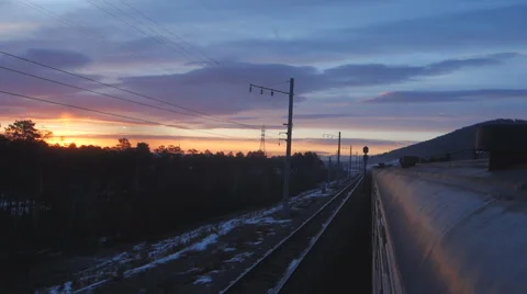 The movement of the train at sunset Stock Footage 61799377