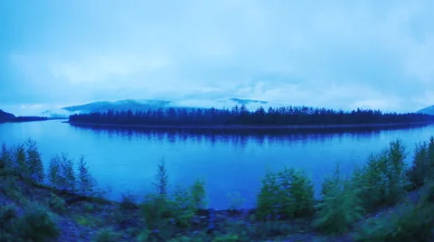 The movement of the train through the woods along the river Stock-Footage 65299677