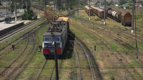The movement of a Train wagons loaded with Track on Railway Tracks Stock Footage 237470443