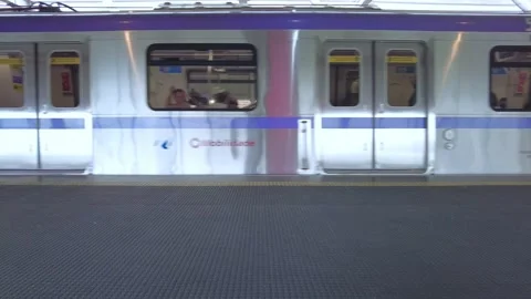 Movement of trains and passengers in platform of Santo Amaro station, Stock Footage 149861735