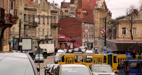 The movement of the tram through the ancient architecture of the city Stock Footage 240107835