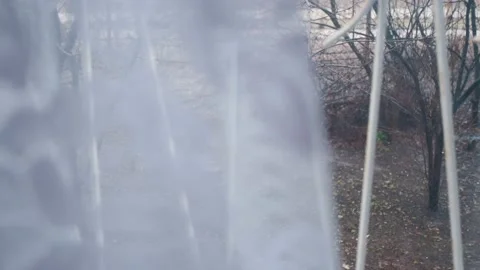 Movement from under the curtain to the view from the window to the backyard Stock Footage 153550686