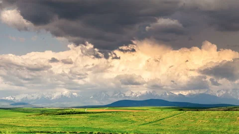 The movement of volumetric beautiful clouds over the hills, In spring in sunny w Stock Footage 108106511