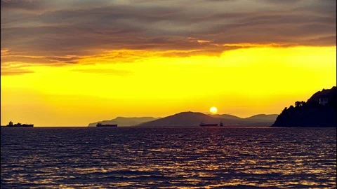 The movement of water, clouds and the sun. Beautiful sunset at the sea. time Stock Footage 115752582