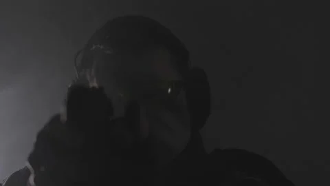 Movement with weapons. Tactics. Aiming. Workout. Black background. Stock Footage 229314439