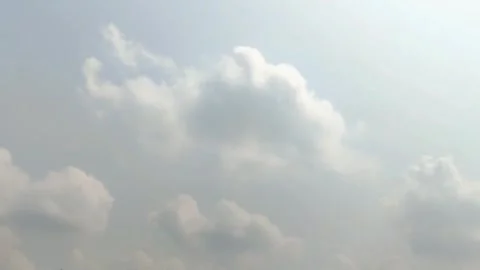 The movement of white clouds in the blue sky Stock Footage 254755659