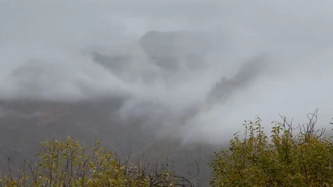 The movements of clouds up to the slopes of the mountains of Caucasus peaks. Stock Footage 70152518