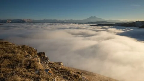 The movements of clouds up to the slopes of the mountains of Caucasus peaks. Stock Footage 70301335