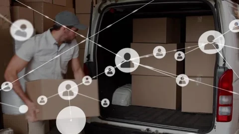 Mover loading boxes into white van for delivery, bending and picking box causing Stock Footage 329836587