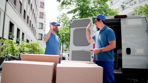 Movers Giving High Five After Unloading Stock Footage 314136480