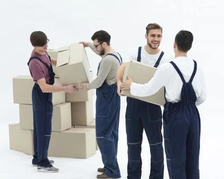 Movers lifting stack of cardboard moving boxes isolated on white 스톡 사진