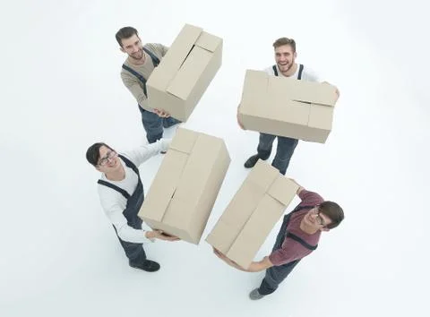Movers lifting stack of cardboard moving boxes isolated on white Foto stock