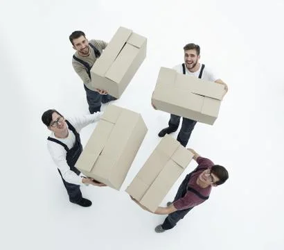 Movers lifting stack of cardboard moving boxes isolated on white Foto stock