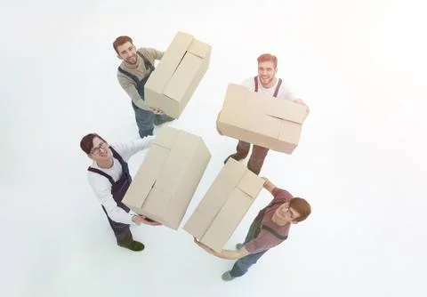 Movers lifting stack of cardboard moving boxes isolated on white 写真素材