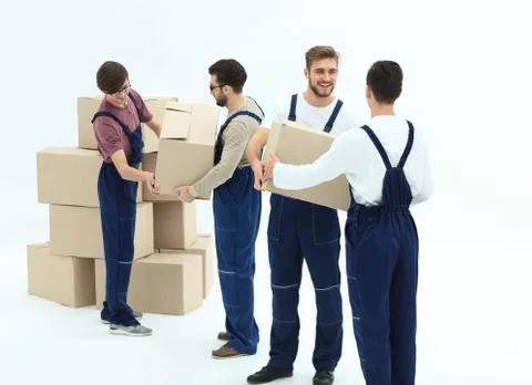 Movers lifting stack of cardboard moving boxes isolated on white 写真素材