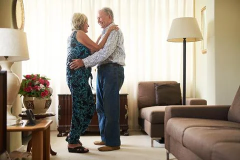The moves that won her heart all those years ago. a happy senior couple dancing Stock Photos