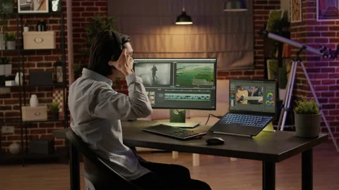 Movie and sound engineer using editing software to create visual effects Stock Footage 200371840