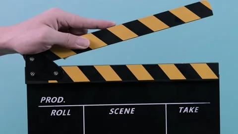 Movie clapperboard. Close up man hand hold film making movie slate. Stock Footage 146310004