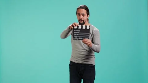 Movie director using clapper on set, filming video production Video stock 318164488