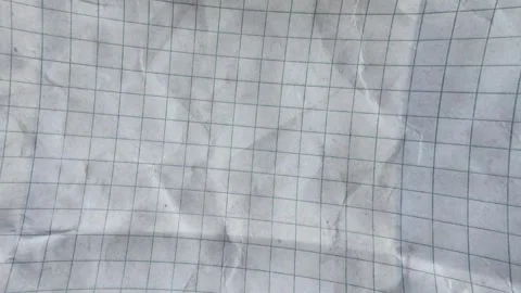 Moving Abstract Background of Crumpled Grid Paper Texture Vidéo 333349969