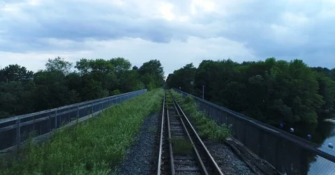 Moving Across Old, Grassy Train Tracks Stock Footage 78175411