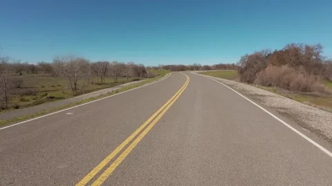 Moving across a solid yellow line on a country road Stock Footage 301132897