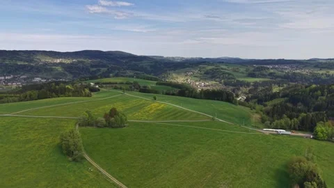 Moving Aerial View Over Rolling Hills Patchwork Farmland with Winding Roads, Stock Footage 346261546