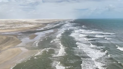 Moving Along Breaking Surf and Coastal Dunes Near Atins Stock Footage 342441407